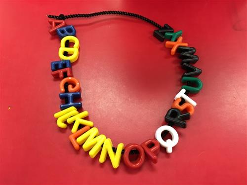 Alphabet necklace to reinforce the alphabets order. 