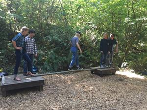 Arts and Technology High School students traverse an obstacle course. 