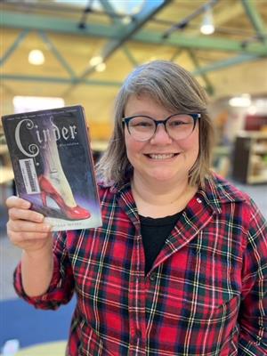 Meg Groat holding the book, Cinder
