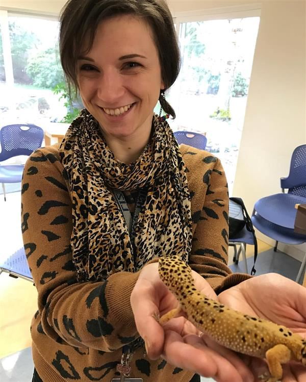 Liz Kinder holding a leopard gecko at CREST Center Liz Kinder holding a leopard gecko at CREST Center