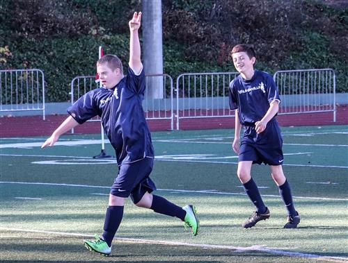 Wilsonville High School Unified Soccer players celebrate a goal. 