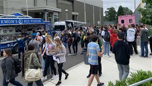 Students enjoy food trucks on Unity Day May 24. 