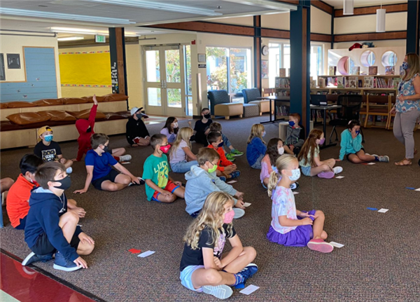 Students participate in an activity in the Stafford library.