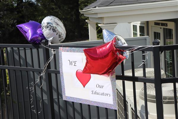 A sign hangs that reads: We love our educators.